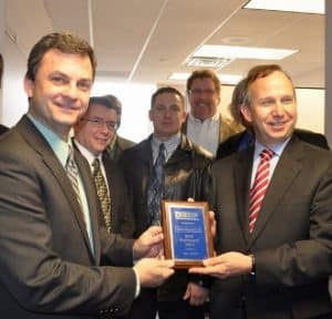Info Solutions receives an award from Gov. Jack Markell